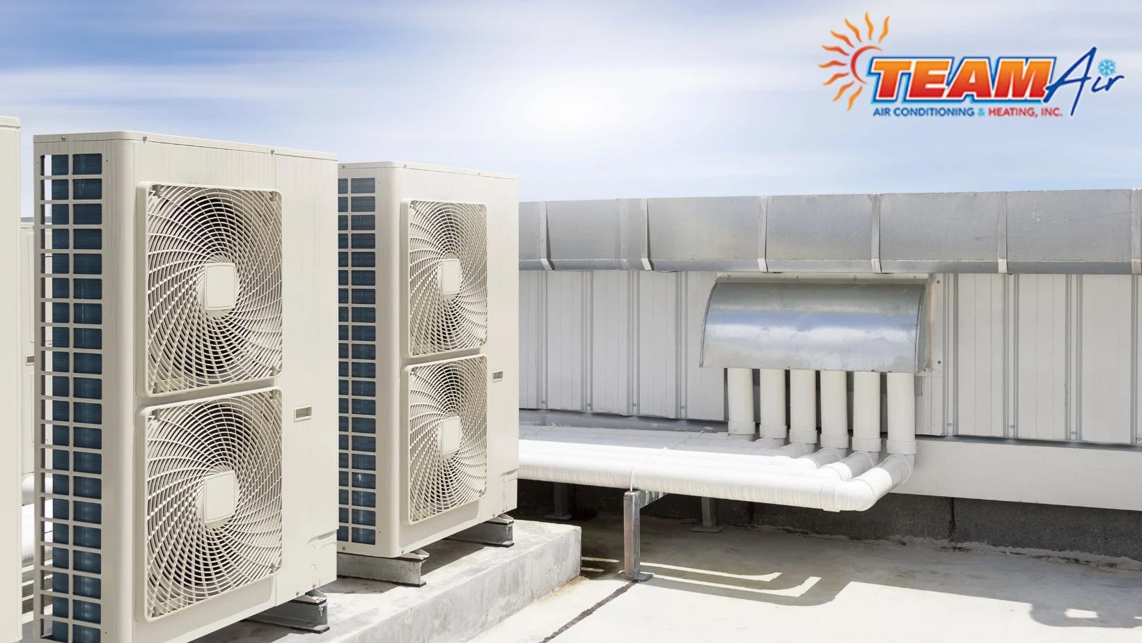 Certified technicians inspecting commercial heat pumps to maintain employee productivity and consistent indoor comfort