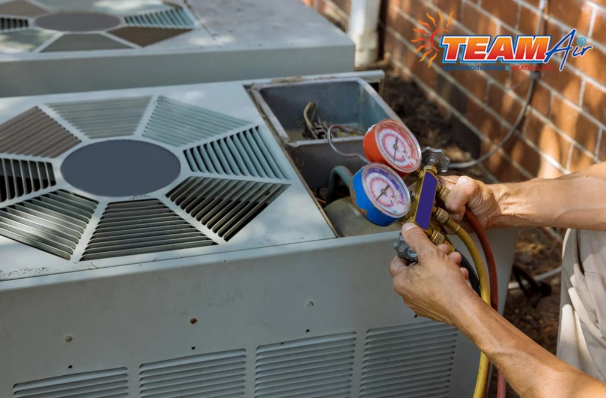 Technician inspecting air filters Improving indoor air quality during an AC maintenance appointment for a healthier and more comfortable year-round environment