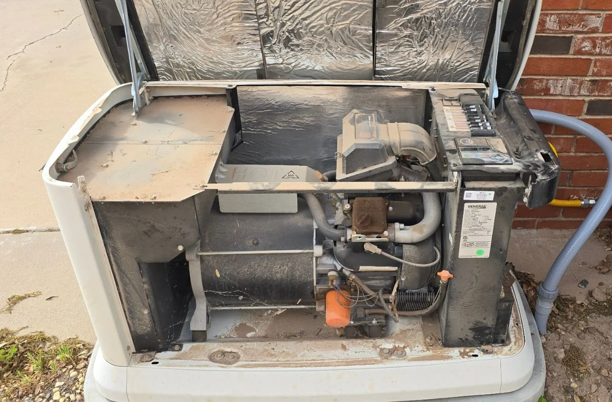 Technician checking generator oil levels to ensure reliable performance and peace of mind for homeowners during unexpected coastal power outages