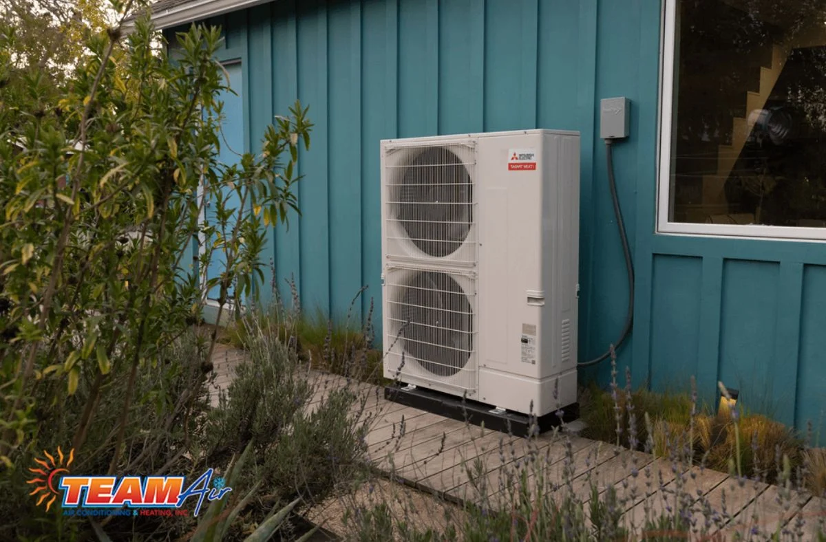 Homeowner choosing to install a heat pump to save money on energy bills and improve cooling efficiency with a Generac installed, too